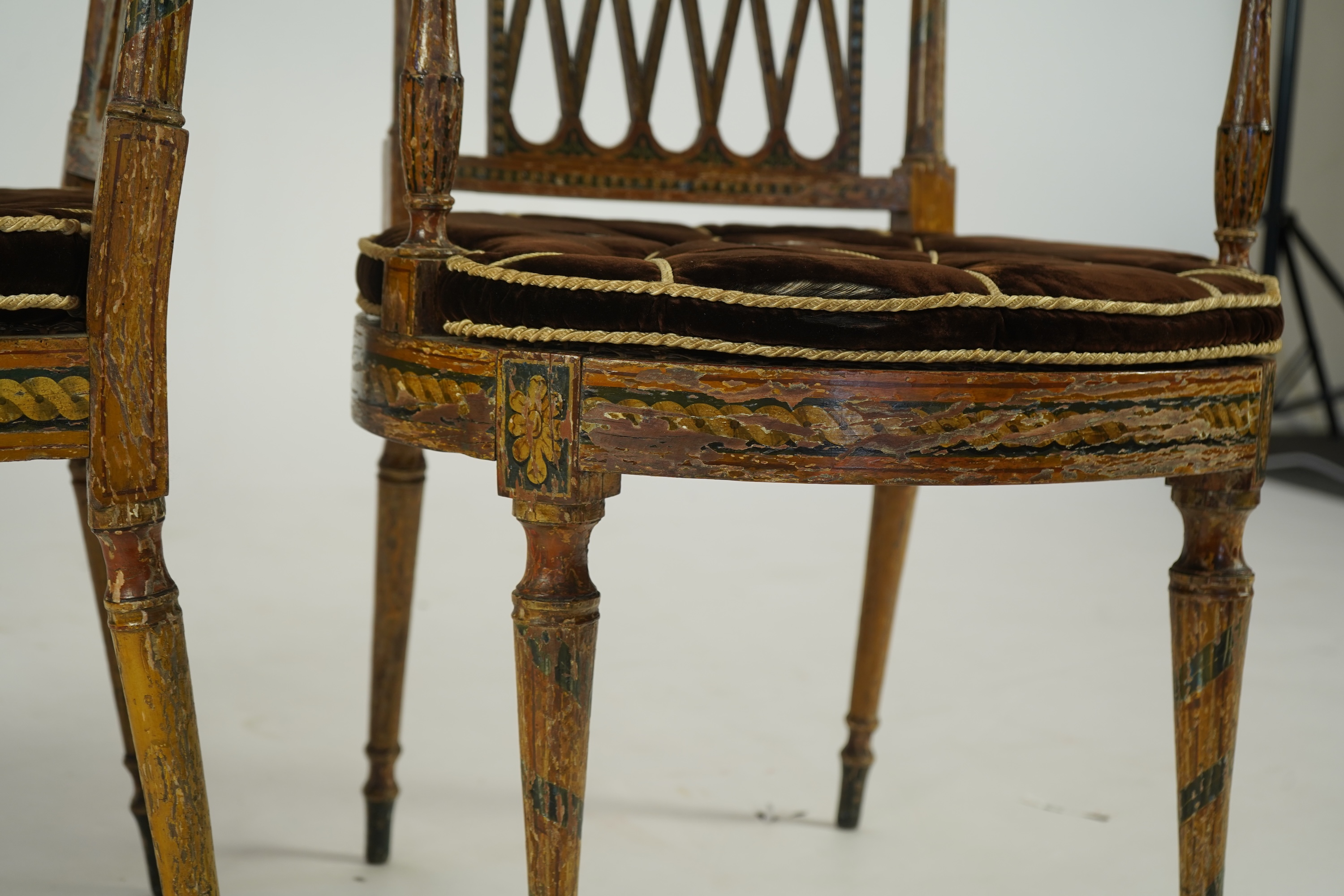 A set of six Sheraton period painted decorated cane seat elbow chairs